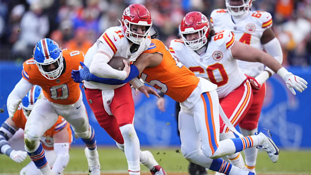 Denver Broncos linebacker Nik Bonitto (15) sacks Kansas City Chiefs quarterback Carson Wentz (11).