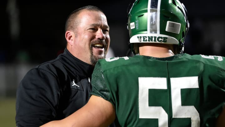 Venice head coach John Peacock and defensive lineman Trenton Kintigh celebrate Venice's victory over the Buchholz Bobcats in a 2022 Class 4 Suburban state semifinal at Powell-Davis Stadium in Venice. But Peacock and his team have lost the last two years in the state finals.