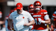 Louisville Cardinals head football coach Jeff Brohm runs onto the field with his team as they take on visiting Bowling Green in Louisville, Kentucky. Sept. 20, 2025