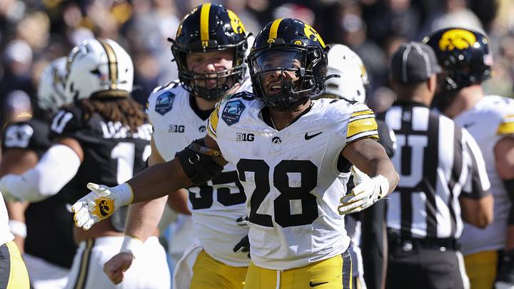 Dec 31, 2025; Tampa, FL, USA; Iowa Hawkeyes running back Kamari Moulton (28) reacts after a touchdown against the Vanderbilt Commodores in the first quarter during the ReliaQuest Bowl at Raymond James Stadium. Mandatory Credit: Nathan Ray Seebeck-Imagn Images