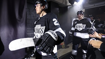 Nov 7, 2024; Los Angeles, California, USA; Los Angeles Kings defenseman Jordan Spence (21) enters the ice before a game against the Vancouver Canucks at Crypto.com Arena. Mandatory Credit: Kiyoshi Mio-Imagn Images