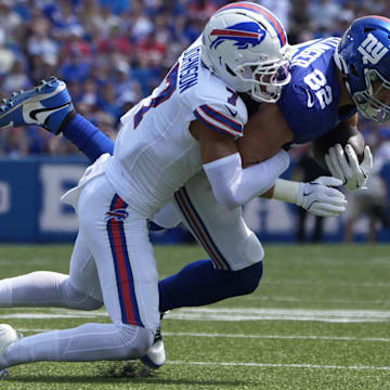 Buffalo Bills cornerback Taron Johnson tackles New York Giants tight end Daniel Bellinger.