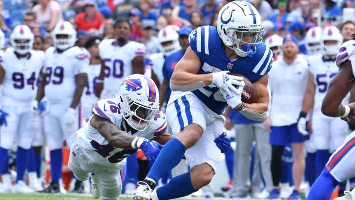 Aug 12, 2023; Orchard Park, New York, USA; Indianapolis Colts running back Evan Hull (26) breaks a tackle by Buffalo Bills cornerback Ja'Marcus Ingram (46) in the first quarter of a pre-season game at Highmark Stadium. Mandatory Credit: Mark Konezny-USA TODAY Sports