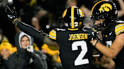 Iowa Hawkeyes running back Kaleb Johnson (2) celebrates his touchdown against the Nebraska Cornhuskers with teammate Dayton Howard (7) Friday, Nov. 29, 2024 at Kinnick Stadium in Iowa City, Iowa.