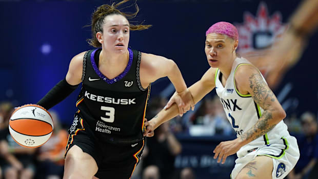 Connecticut Sun guard Marina Mabrey dribbles the basketball past a defender