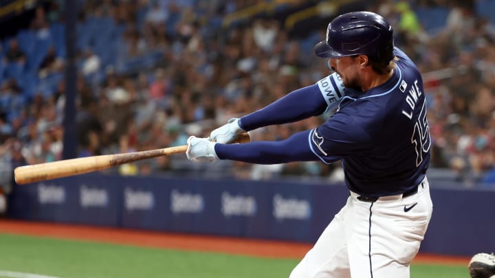 Jun 24, 2024; St. Petersburg, Florida, USA; Tampa Bay Rays outfielder Josh Lowe (15) singles against the Seattle Mariners during the third inning at Tropicana Field. Mandatory Credit: Kim Klement Neitzel-USA TODAY Sports