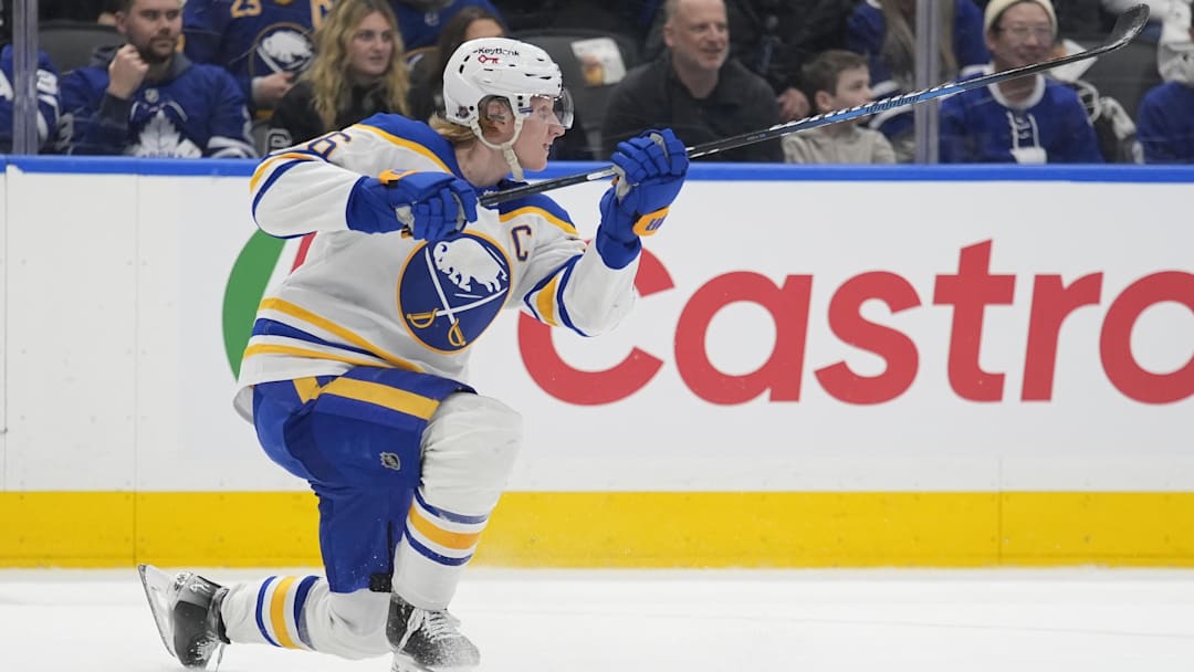 Jan 27, 2026; Toronto, Ontario, CAN; Buffalo Sabres defenseman Rasmus Dahlin (26) scores with this shot on an empty net against the Toronto Maple Leafs during the third period at Scotiabank Arena. Mandatory Credit: John E. Sokolowski-Imagn Images