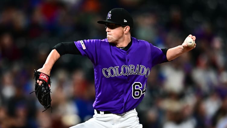 Colorado Rockies relief pitcher Phillip Diehl (64) delivers a pitch.