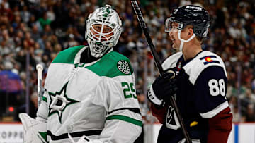 Mar 16, 2025; Denver, Colorado, USA; Dallas Stars goaltender Jake Oettinger (29) and Colorado Avalanche center Martin Necas (88) talk during a stoppage of play in the second period at Ball Arena. Mandatory Credit: Isaiah J. Downing-Imagn Images