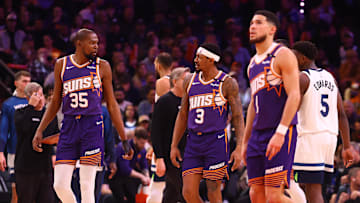 Jan 29, 2025; Phoenix, Arizona, USA; Phoenix Suns forward Kevin Durant (35) with guard Bradley Beal (3) and Devin Booker (1) against the Minnesota Timberwolves at Footprint Center. Mandatory Credit: Mark J. Rebilas-Imagn Images
