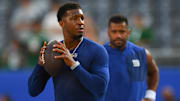 Aug 16, 2025; East Rutherford, New Jersey, USA; New York Giants quarterback Jameis Winston (left) warms up as quarterback Russell Wilson (right) looks on prior to the game against the New York Jets at MetLife Stadium.  