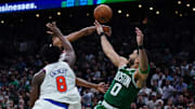 Jayson Tatum throws the ball away at the end of the Celtics loss to the Knicks.