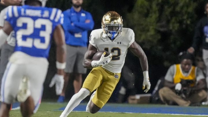 Sep 30, 2023; Durham, North Carolina, USA; Notre Dame Fighting Irish running back Jeremiyah Love (12) runs for yards after catch against the Duke Blue Devils during the second half at Wallace Wade Stadium. Mandatory Credit: Jim Dedmon-USA TODAY Sports