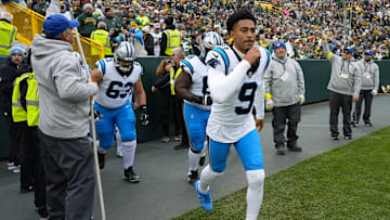 Caption:Nov 2, 2025; Green Bay, Wisconsin, USA; Carolina Panthers quarterback Bryce Young (9) runs onto the field prior to the game against the Green Bay Packers at Lambeau Field. 