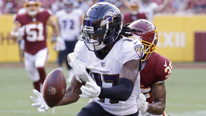 Baltimore Ravens wide receiver Deon Cain attempts to catch a pass as Washington Football Team cornerback Torry McTyer defends in the first quarter at FedExField in a 2021 game.