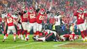 Nov 4, 2024; Kansas City, Missouri, USA; Kansas City Chiefs running back Kareem Hunt (29) scores the game-winning touchdown against the Tampa Bay Buccaneers as guard Joe Thuney (62) and guard Mike Caliendo (66) celebrate during the game at GEHA Field at Arrowhead Stadium. Mandatory Credit: Denny Medley-Imagn Images