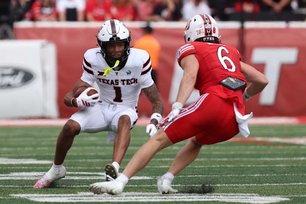 Red Raiders wide receiver Reggie Virgil runs after a catch against Utah safety Nate Ritchie.