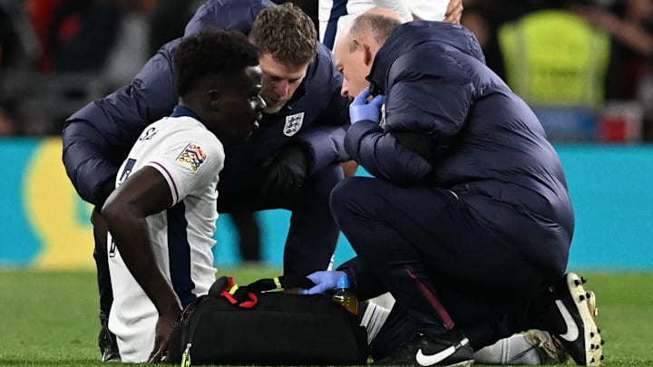 Bukayo Saka (left) appeared to suffer a hamstring injury against Greece.