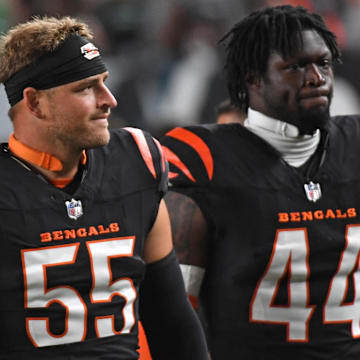 Cincinnati Bengals linebackers Logan Wilson and Demetrius Knight Jr. walk off the field against the Philadelphia Eagles at Lincoln Financial Field. 