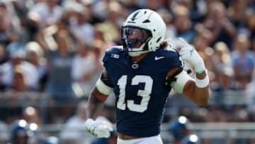 Sep 13, 2025; University Park, Pennsylvania, USA; Penn State Nittany Lions linebacker Tony Rojas (13) reacts following a sack on Villanova Wildcats quarterback Tanner Maddocks (3) during the second quarter at Beaver Stadium. Mandatory Credit: Matthew O'Haren-Imagn Images