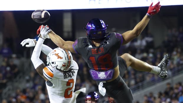 Oklahoma State Cowboys cornerback Korie Black (2) defends a pass intended for TCU Horned Frogs wide receiver Jack Bech (18).