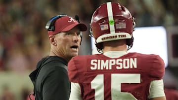 Alabama head coach Kalen DeBoer talks to Alabama quarterback Ty Simpson (15)