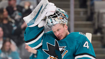 Feb 8, 2025; San Jose, California, USA; San Jose Sharks goaltender Vitek Vanecek (41) raises his hockey mask during a timeout against the Dallas Stars during the third period at SAP Center at San Jose. Mandatory Credit: Robert Edwards-Imagn Images