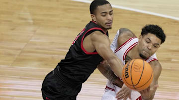 Ball State guard Juwan Maxey (3, left) and Wisconsin guard Nick Boyd (2) vie for a rebound during the first half of their game Tuesday, November 11, 2025 at the Kohl Center in Madison, Wisconsin.