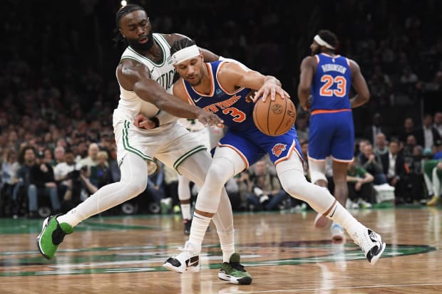 Apr 11, 2024; Boston, Massachusetts, USA;  Boston Celtics guard Jaylen Brown (7) tries to steal the ball from New York Knicks guard Josh Hart (3) during the second half at TD Garden. Mandatory Credit: Bob DeChiara-USA TODAY Sports