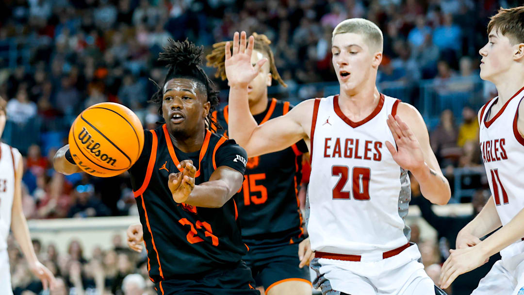 Douglass    Jaden Nickens (23) passes the ball during the championship of the boys state basketball tournament between Douglass and Weatherford at the Jim Norick Arena in Oklahoma City, on Saturday, March 9, 2024.
