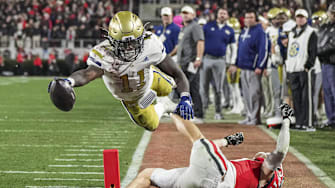 Nov 29, 2024; Athens, Georgia, USA; Georgia Tech Yellow Jackets running back Jamal Haynes (11) scores a touchdown past Georgia Bulldogs defensive back Dan Jackson (17) during the first half at Sanford Stadium. Mandatory Credit: Dale Zanine-Imagn Images