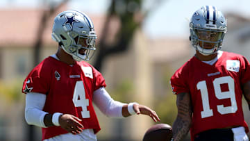Jul 26, 2024; Oxnard, CA, USA; Dallas Cowboys quarterbacks Dak Prescott (4) and Trey Lance (19) during training camp at the River Ridge Playing Fields in Oxnard, California.