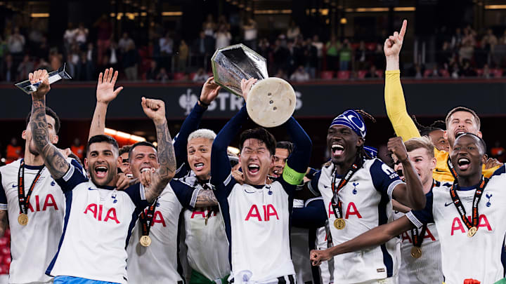 Son Heung-min (C) of Tottenham Hotspur FC lifts the trophy...