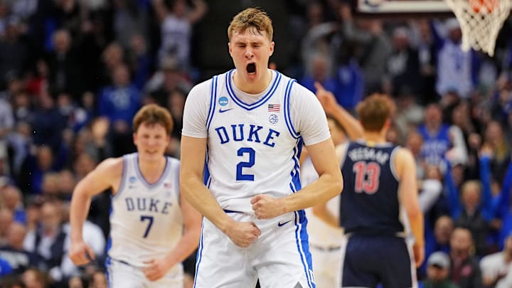 Mar 27, 2025; Newark, NJ, USA; Duke basketball forward Cooper Flagg (2) reacts after making a last second shot to end the first half against the Arizona Wildcats during an East Regional semifinal of the 2025 NCAA tournament at Prudential Center.