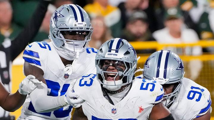 Dallas Cowboys cornerback Joey Porter Jr. (25), defensive end Arron Mosby (53) and defensive tackle Otito Ogbonnia (91) celebrate after Mosby intercepts a pass against the Green Bay Packers on Sunday, Oct. 18, 2026, at Lambeau Field in Green Bay, Wisconsin. 
Tork Mason/Green Bay Press-Gazette