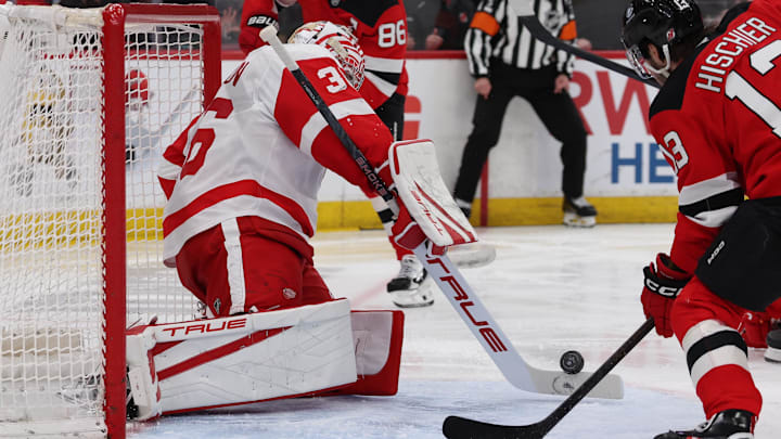 Mar 8, 2026; Newark, New Jersey, USA;  Detroit Red Wings goaltender John Gibson (36) uses his stick to make a stop against the New Jersey Devils during the second period at Prudential Center. Mandatory Credit: Thomas Salus-Imagn Images