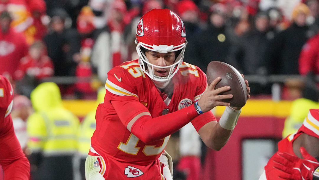 Jan 18, 2025; Kansas City, Missouri, USA; Kansas City Chiefs quarterback Patrick Mahomes (15) takes a snap against the Houston Texans during the second half of a 2025 AFC divisional round game at GEHA Field at Arrowhead Stadium.