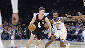 Mar 3, 2025; Oklahoma City, Oklahoma, USA; Houston Rockets guard Reed Sheppard (15) moves the ball down the court beside Oklahoma City Thunder guard Cason Wallace (22) during the second half at Paycom Center. Mandatory Credit: Alonzo Adams-Imagn Images
