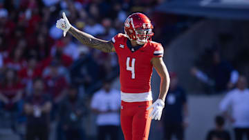 Nov 30, 2024; Tucson, Arizona, USA; Arizona Wildcats wide receiver Tetairoa McMillan (4) against the Arizona State Sun Devils during the Territorial Cup at Arizona Stadium. Mandatory Credit: Mark J. Rebilas-Imagn Images