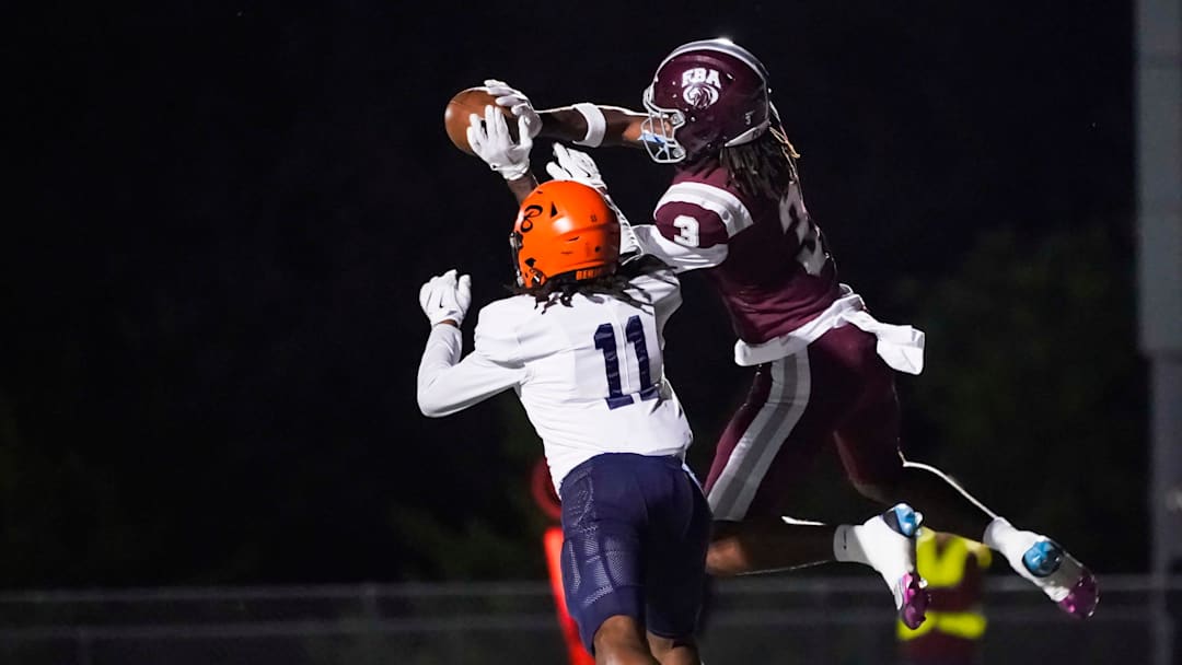 First Baptist Academy Lions receiver Jayden Petit (3) makes a contested catch for a touchdown over Benjamin Buccaneers defender Jayden Cosby-Mosley (11) during the first quarter of the Class 1A regional semifinal at First Baptist Academy in Naples on Friday, Nov. 22, 2024.