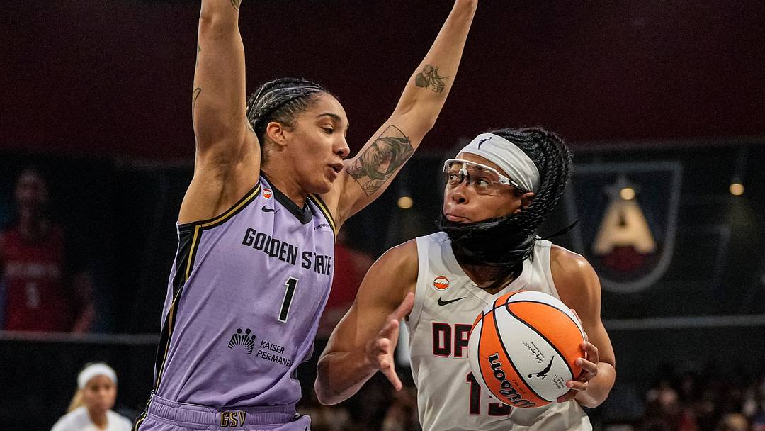 Jul 4, 2026; College Park, Georgia, USA; Atlanta Dream guard Allisha Gray (15) controls the ball against Golden State Valkyries forward Gabby Williams (1) during the first half at Gateway Center Arena at College Park. Mandatory Credit: Dale Zanine-Imagn Images
