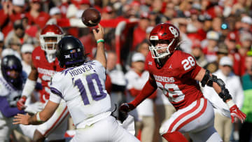 Oklahoma Sooners linebacker Danny Stutsman (28) runs after TCU Horned Frogs quarterback Josh Hoover (10) as he throws a pass during a college football game between the University of Oklahoma Sooners (OU) and the TCU Horned Frogs at Gaylord Family-Oklahoma Memorial Stadium in Norman, Okla., Oklahoma won 69-45.