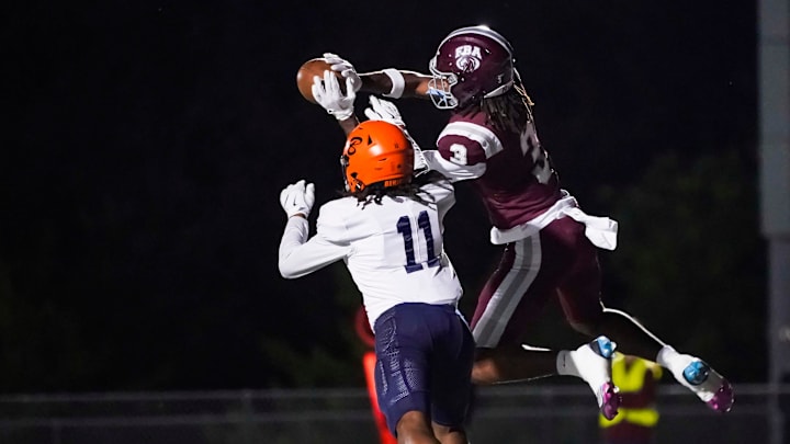 First Baptist Academy Lions receiver Jayden Petit (3) makes a contested catch for a touchdown over Benjamin Buccaneers defender Jayden Cosby-Mosley (11) during the first quarter of the Class 1A regional semifinal at First Baptist Academy in Naples on Friday, Nov. 22, 2024.