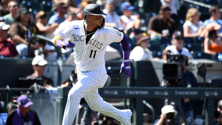 Sep 7, 2025; Denver, Colorado, USA; Colorado Rockies shortstop Orlando Arcia (11) scores during the third inning against the San Diego Padres at Coors Field. 
