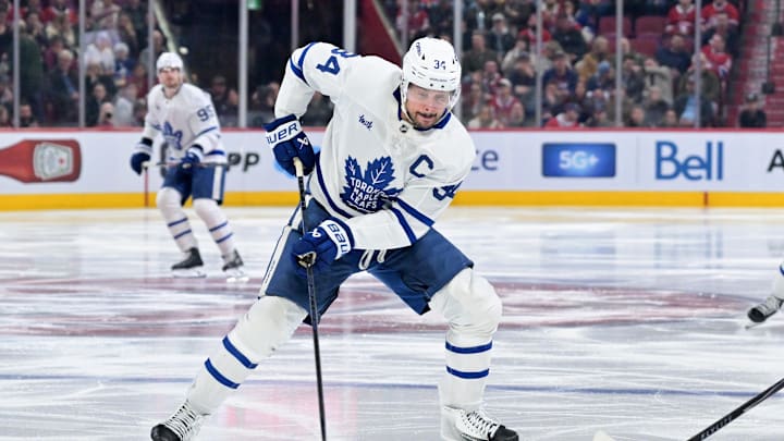 Mar 10, 2026; Montreal, Quebec, CAN; Toronto Maple Leafs forward Auston Matthews (34) plays the puck during the third period against the Montreal Canadiens at the Bell Centre. Mandatory Credit: Eric Bolte-Imagn Images