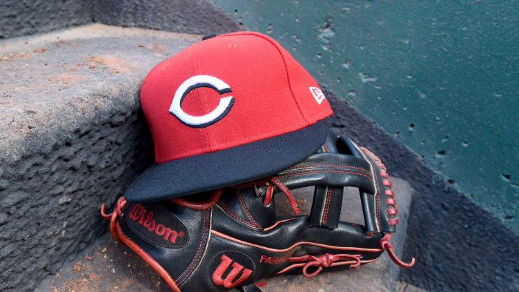 Cincinnati Reds glove and hat.