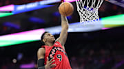 Mar 30, 2025; Philadelphia, Pennsylvania, USA; Toronto Raptors guard RJ Barrett (9) dunks the ball against the Philadelphia 76ers during the fourth quarter at Wells Fargo Center. 