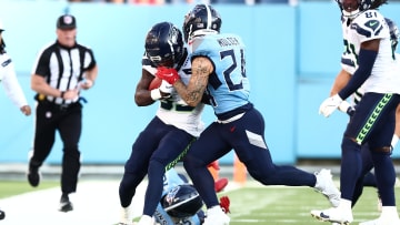 Aug 17, 2024; Nashville, Tennessee, USA; Seattle Seahawks wide receiver Dee Williams (33) is pushed out of bounds by Tennessee Titans cornerback Elijah Molden (24) in the first quarter of the game at Nissan Stadium.