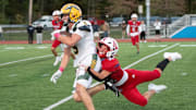 King Philip Regional senior captain Brooks McDonald (5) runs the ball in a game against Natick on Oct. 3.