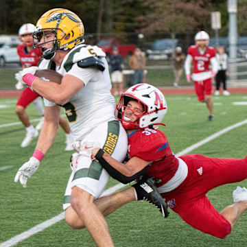 King Philip Regional senior captain Brooks McDonald (5) runs the ball in a game against Natick on Oct. 3.